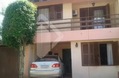 Casa em condomínio fechado com 2 quartos à venda na avenida juca batista, 1490, belém novo, porto alegre, 123 m2 por r$ 600.000