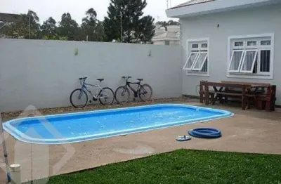 Casa em condomínio fechado com 4 quartos à venda na rua áustria, 196, marechal rondon, canoas, 270 m2 por r$ 1.200.000