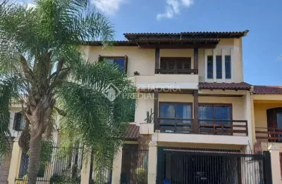 Casa em condomínio fechado com 4 quartos à venda na rua maestro salvador campanella, 116, jardim itu sabará, porto alegre, 410 m2 por r$ 1.400.000