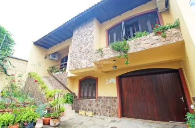 Casa com 3 quartos à venda na rua umbú, 137, passo da areia, porto alegre, 154 m2 por r$ 1.280.000