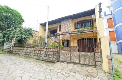 Casa com 3 quartos à venda na rua umbú, 137, passo da areia, porto alegre, 154 m2 por r$ 1.050.000