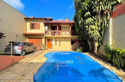 Casa em condomínio fechado com 4 quartos à venda na rua francisca lechner, 343, parque santa fé, porto alegre, 263 m2 por r$ 650.000