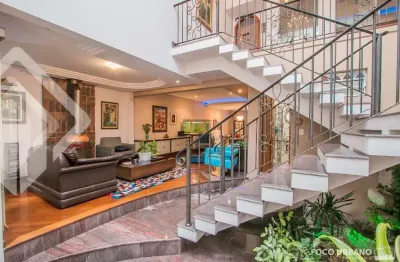 Casa em condomínio fechado com 3 quartos à venda na rua maestro salvador campanella, 395, jardim itu sabará, porto alegre, 397 m2 por r$ 1.499.000