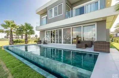 Casa em condomínio fechado com 5 quartos à venda na rua rio jacuí, 1331, centro, xangri-lá, 415 m2 por r$ 5.400.000