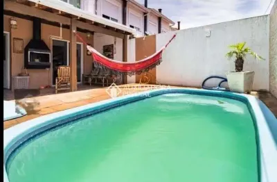 Casa em condomínio fechado com 3 quartos à venda na avenida edgar pires de castro, 2520, hípica, porto alegre, 83 m2 por r$ 408.000