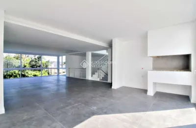 Casa em condomínio fechado com 3 quartos à venda na rua ivo walter kern, 599, hípica, porto alegre, 256 m2 por r$ 1.669.900