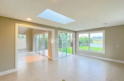 Casa em condomínio fechado com 3 quartos à venda na avenida juca batista, 9000, belém novo, porto alegre, 295 m2 por r$ 2.100.000