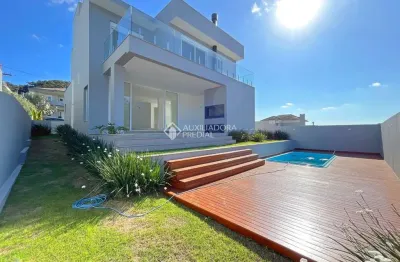 Casa em condomínio fechado com 4 quartos à venda na estrada das três meninas, 2001, vila nova, porto alegre, 293 m2 por r$ 2.390.000