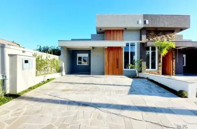 Casa em condomínio fechado com 3 quartos à venda na avenida juca batista, 5505, hípica, porto alegre, 164 m2 por r$ 699.000