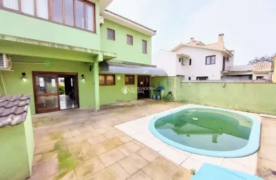 Casa em condomínio fechado com 3 quartos à venda na rua louro, 34, hípica, porto alegre, 167 m2 por r$ 650.000