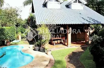 Casa em condomínio fechado com 5 quartos à venda na rua pedro de oliveira frança, 572, hípica, porto alegre, 270 m2 por r$ 1.200.000
