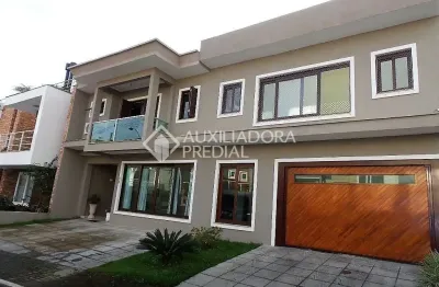 Casa em condomínio fechado com 3 quartos à venda na rua carlos maximiliano fayet, 80, hípica, porto alegre, 305 m2 por r$ 1.100.000