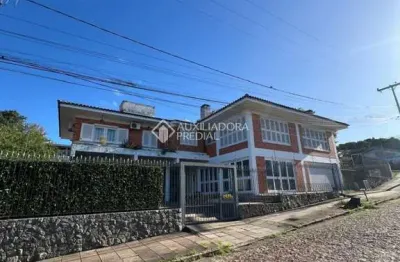 Casa com 3 quartos à venda na Rua Açores, 377, Tarumã, Viamão, 422 m2 por R$ 1.200.000