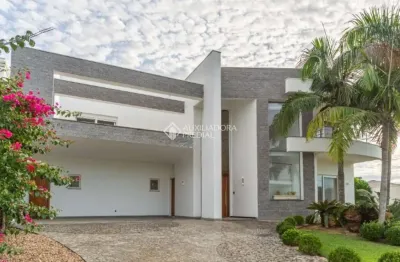 Casa em condomínio fechado com 4 quartos à venda na avenida juca batista, 8000, belém novo, porto alegre, 432 m2 por r$ 2.700.000