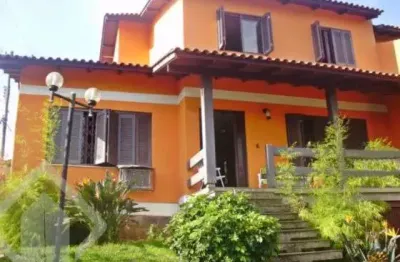 Casa em condomínio fechado com 5 quartos à venda na rua ângelo passuelo, 79, vila nova, porto alegre, 215 m2 por r$ 650.000