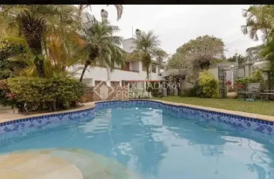 Casa em condomínio fechado com 5 quartos à venda na rua gustavo schmidt, 277, três figueiras, porto alegre, 445 m2 por r$ 3.200.000