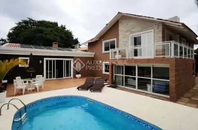 Casa com 3 quartos à venda na rua jacundá, 273, guarujá, porto alegre, 270 m2 por r$ 1.046.000