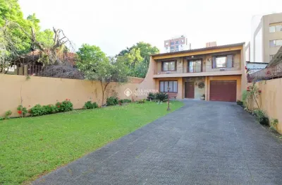 Casa com 3 quartos à venda na avenida joão wallig, 119, passo da areia, porto alegre, 222 m2 por r$ 1.045.000