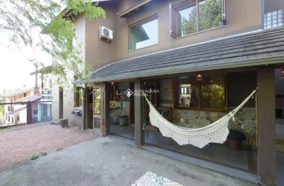 Casa em condomínio fechado com 4 quartos à venda na avenida vicente monteggia, 2000, cavalhada, porto alegre, 243 m2 por r$ 807.500