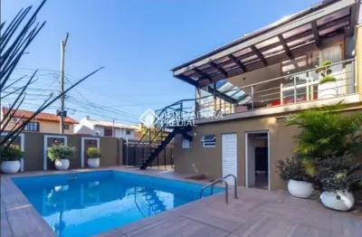 Casa com 4 quartos à venda na rua criciúma, 115, guarujá, porto alegre, 288 m2 por r$ 1.500.000