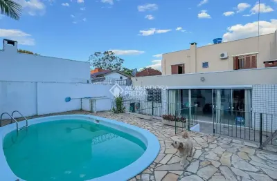 Casa com 4 quartos à venda na Rua Dom Pedrito, 317, Passo da Areia, Porto Alegre, 310 m2 por R$ 1.140.000