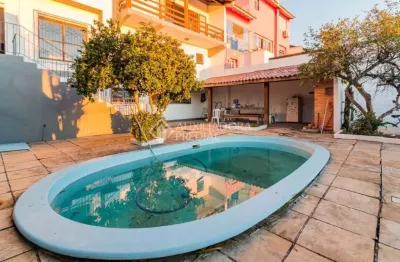 Casa em condomínio fechado com 4 quartos à venda na rua alcebíades antônio dos santos, 513, nonoai, porto alegre, 336 m2 por r$ 979.000