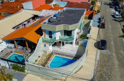 Casa sobrado parte superior à venda com piscina, 4 quarto(s),  sendo 4 suíte(s)  no bairro cidade nova peruíbe, 200 metros da praia, peruíbe-sp