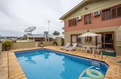 Casa com 4 quartos à venda na rua três de outubro, 172, pátria nova, novo hamburgo por r$ 809.000