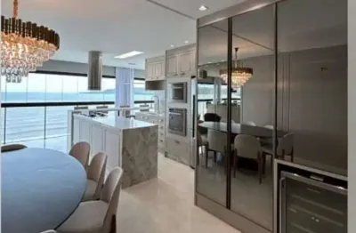 Apartamento frente mar, semi mobiliado, 04 suítes, 04 vagas, meia praia em itapema - sc