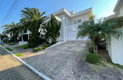 Casa em condomínio fechado com 3 quartos à venda na avenida açucena, 50, estância velha, canoas, 400 m2 por r$ 3.100.000