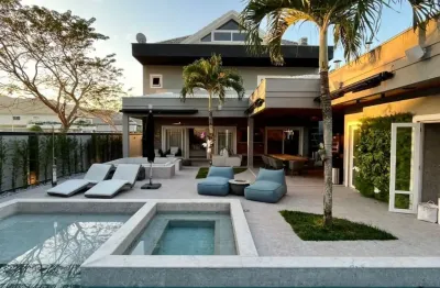 Casa duplex mais sótão com 620 m² e 4 suítes à venda no alphaville barra da tijuca.