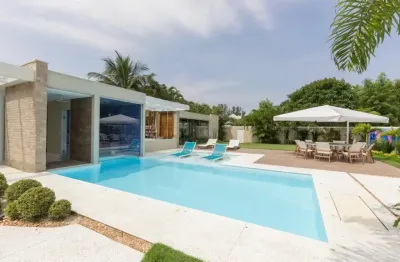 Casa duplex rústica com 4 suítes no condomínio mansões