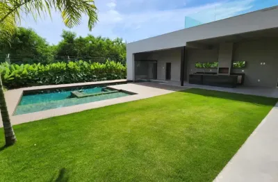 Casa triplex contemporânea com 5 suítes no alphaville barra da tijuca