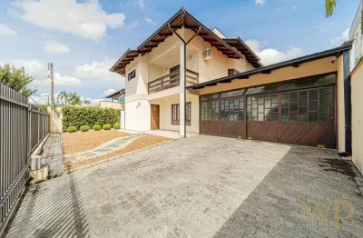 Casa com 4 quartos à venda na rua assis brasil, 92, saguaçu, joinville por r$ 1.350.000