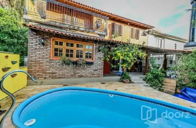 Casa em condomínio fechado com 4 quartos à venda na das figueiras, 108, santa tereza, porto alegre, 200 m2 por r$ 612.000
