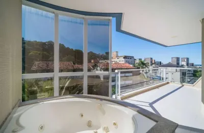 Espaçoso apartamento com 3 suítes e 3 vagas na praia de bombinhas