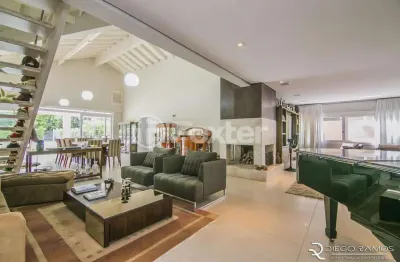 Casa em condomínio fechado com 4 quartos à venda na avenida juca batista, 8000, belém novo, porto alegre, 414 m2 por r$ 2.690.000