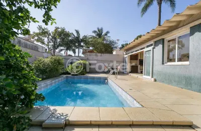 Casa com 4 quartos à venda na rua alfredo schuett, 833, três figueiras, porto alegre, 348 m2 por r$ 1.800.000
