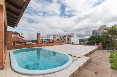 Casa com 4 quartos à venda na rua kyve t. knijnik, 15, espírito santo, porto alegre, 246 m2 por r$ 1.190.000