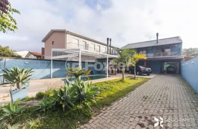Casa com 4 quartos à venda na rua jerolomo minuzo, 317, vila nova, porto alegre, 304 m2 por r$ 900.000