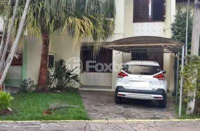 Casa em condomínio fechado com 3 quartos à venda na avenida juca batista, 4115, hípica, porto alegre, 99 m2 por r$ 499.000