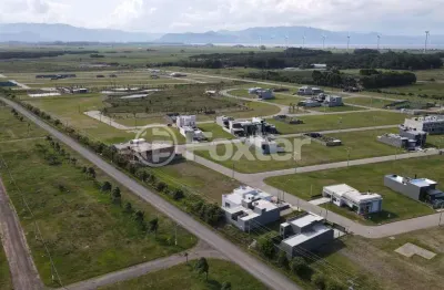 Terreno em condomínio fechado à venda na rua rs-389, 27, bairro planejado, xangri-lá, 243 m2 por r$ 200.000