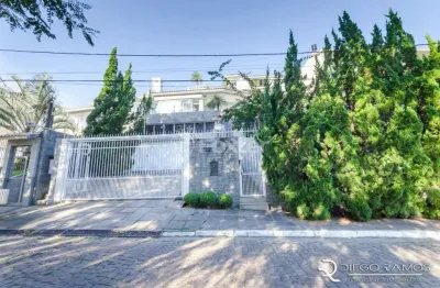 Casa com 3 quartos à venda na rua alcebíades antônio dos santos, 550, nonoai, porto alegre, 399 m2 por r$ 1.790.000