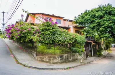 Casa com 5 quartos à venda na rua ângelo passuelo, 79, vila nova, porto alegre, 215 m2 por r$ 650.000