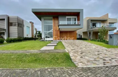 Casa em condomínio fechado com 5 quartos à venda na rua andira, s/n, zona nova, capão da canoa, 386 m2 por r$ 4.100.000