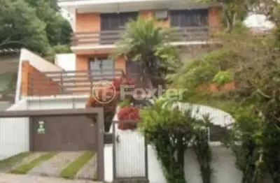 Casa com 3 quartos à venda na avenida fábio araújo santos, 1650, nonoai, porto alegre, 279 m2 por r$ 957.500