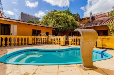 Casa com 2 quartos à venda na rua afonso rodrigues, 263, jardim botânico, porto alegre, 194 m2 por r$ 1.150.000