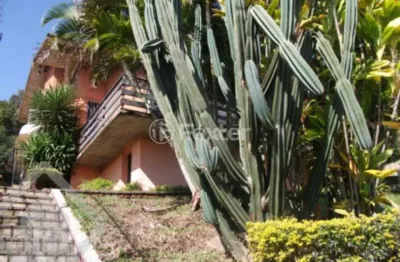Casa com 4 quartos à venda na rua alcebíades antônio dos santos, 260, nonoai, porto alegre, 240 m2 por r$ 900.000