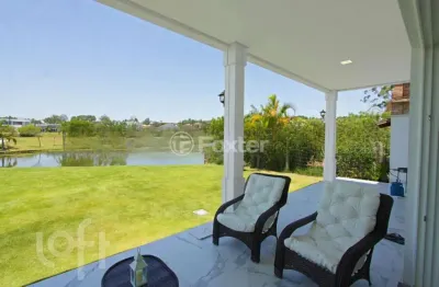 Casa em condomínio fechado com 5 quartos à venda na avenida juca batista, 9000, belém novo, porto alegre, 388 m2 por r$ 4.780.000