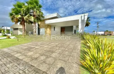 Casa em condomínio fechado com 3 quartos à venda na avenida central, 2009, zona nova, capão da canoa, 196 m2 por r$ 1.190.000